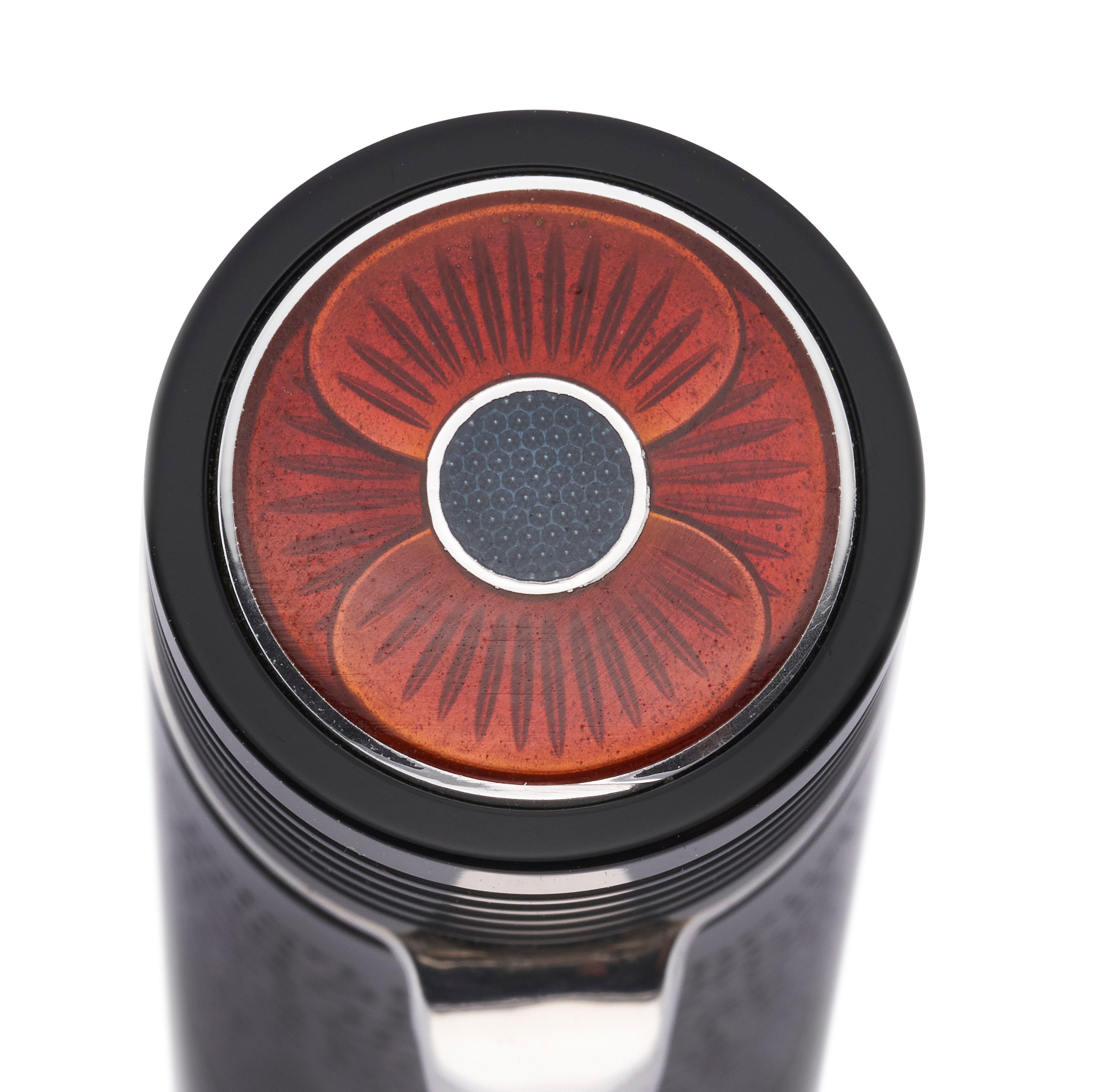 Close-up of the enamel poppy set into the cap top of the VE-Day 80th Anniversary Pen